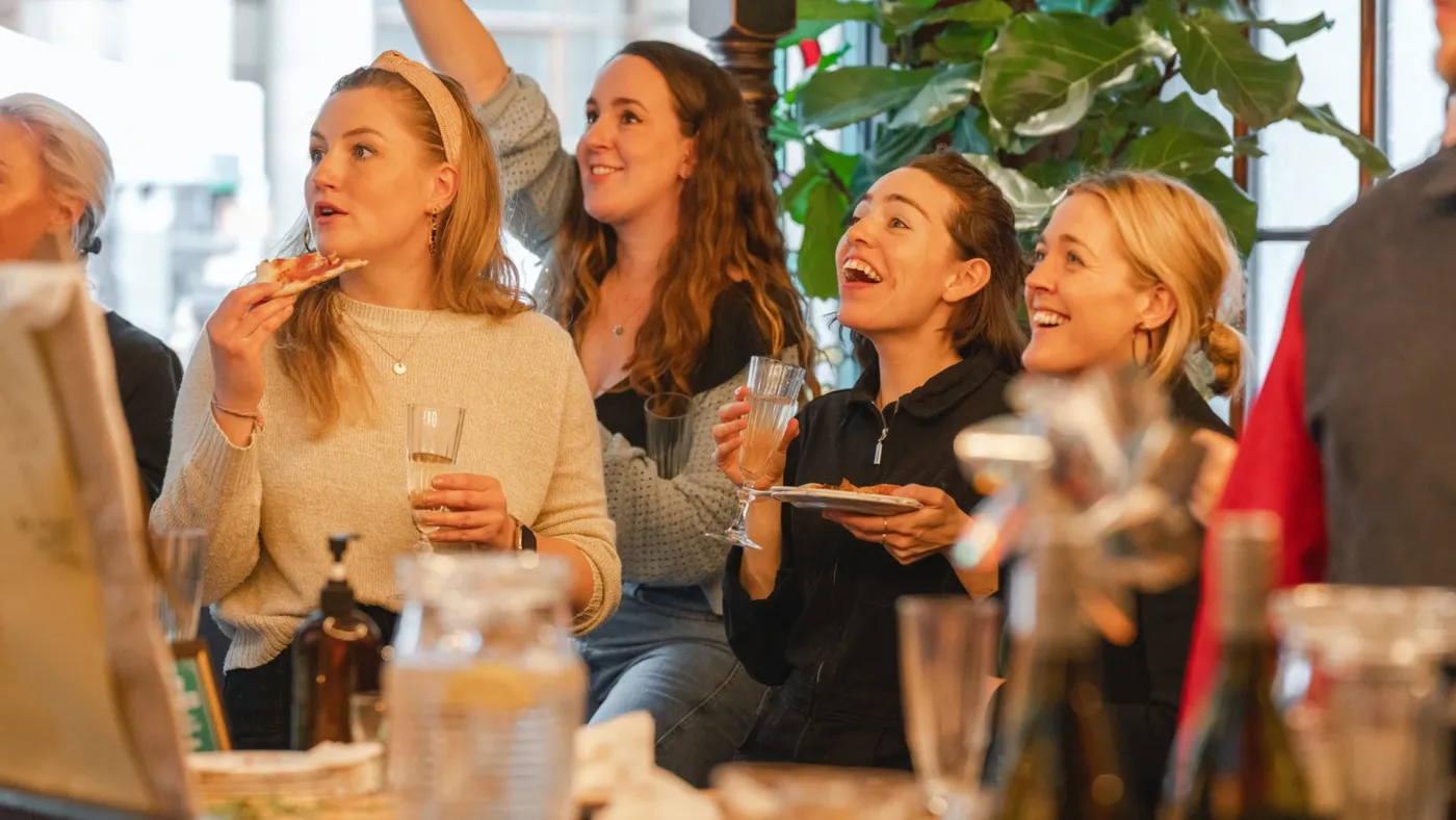 A group playing darts at a Brunch Social in Flight Club 