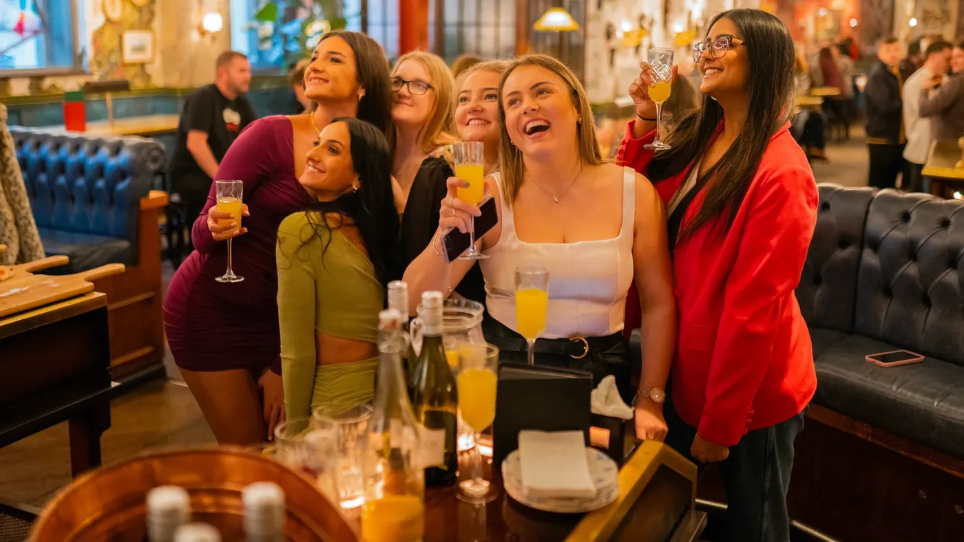 A group drinking Prosecco at a Brunch Social in Flight Club 