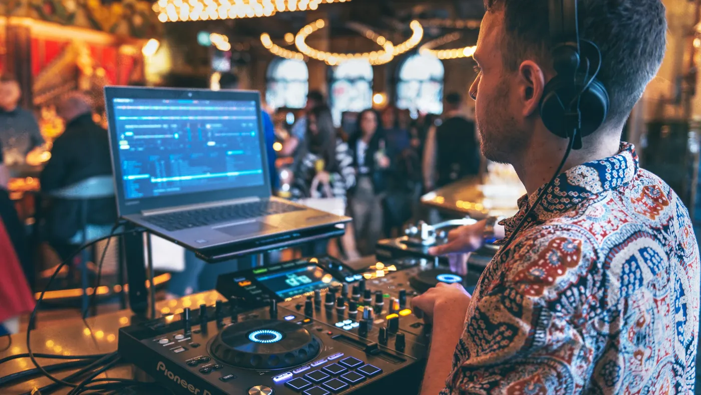 A DJ playing on Saturdays at a Brunch Social in Flight Club