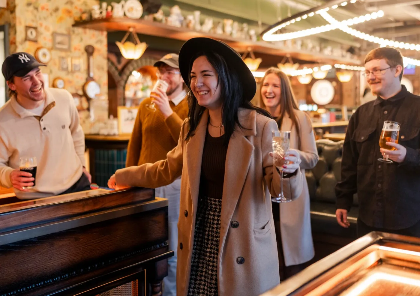girl celebrating after a throw after the races at flight club cheltenham