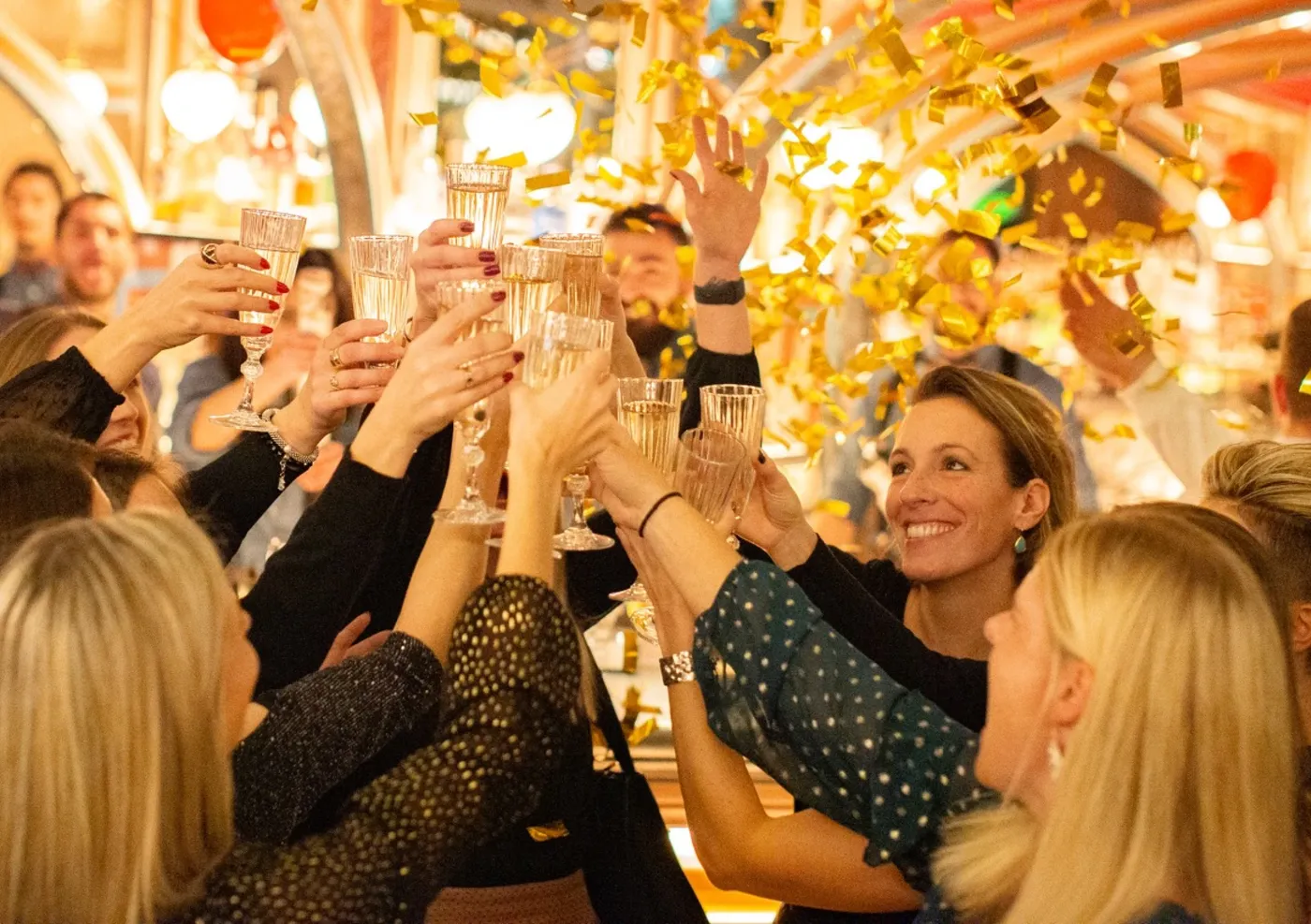 group of friends toasting in flight club