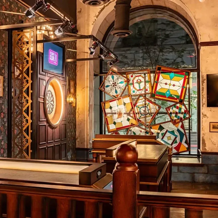 flight club philadelphia play space and stained glass window