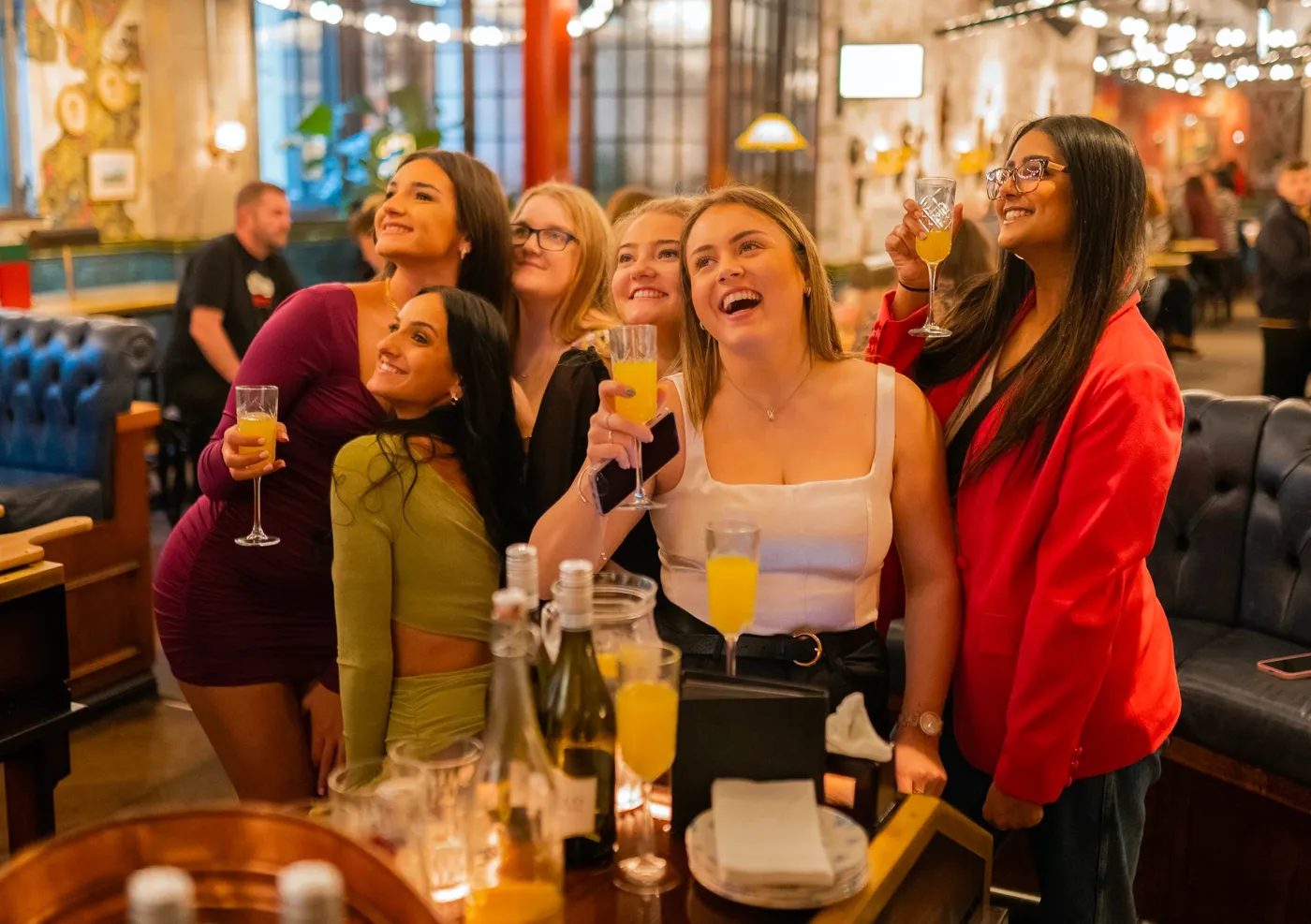 A group drinking Prosecco at a Brunch Social in Flight Club
