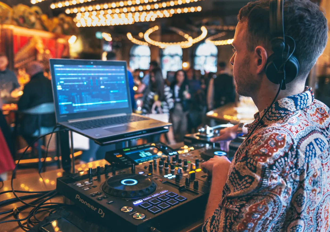 A DJ playing on Saturdays at a Brunch Social in Flight Club