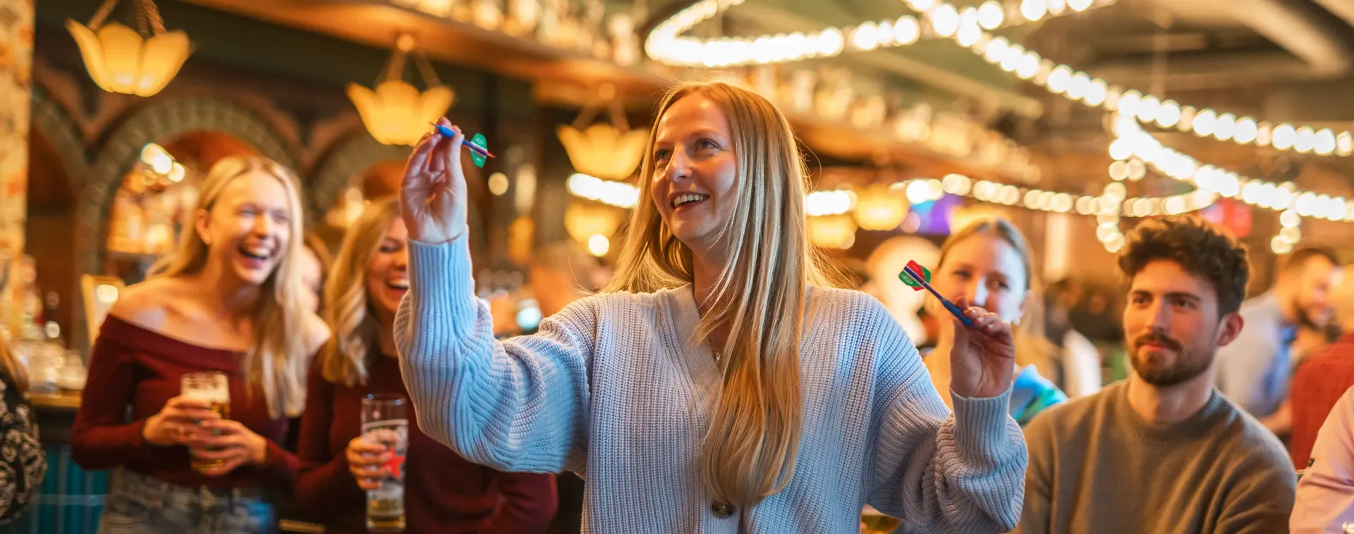 A group of students playing darts in Flight Club